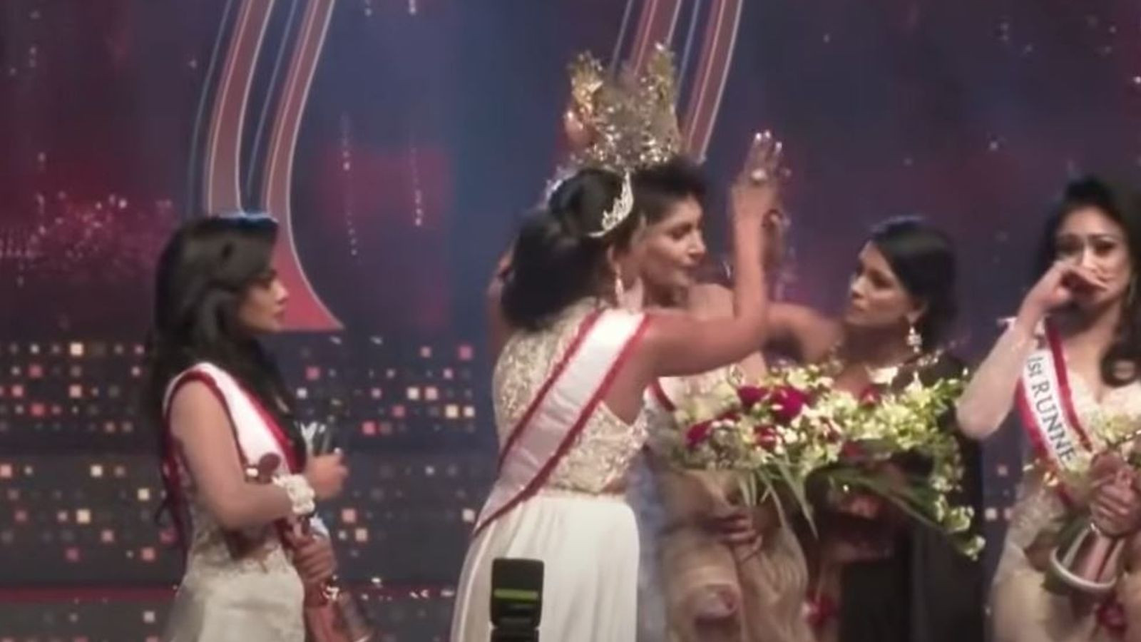 Watch Mrs. Sri Lanka lose her beauty queen crown after it’s ‘snatched’ off her head on stage by Mrs. World over divorce claims (video)