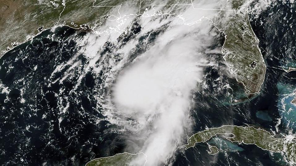 Thousands evacuated as two storms head for southern US